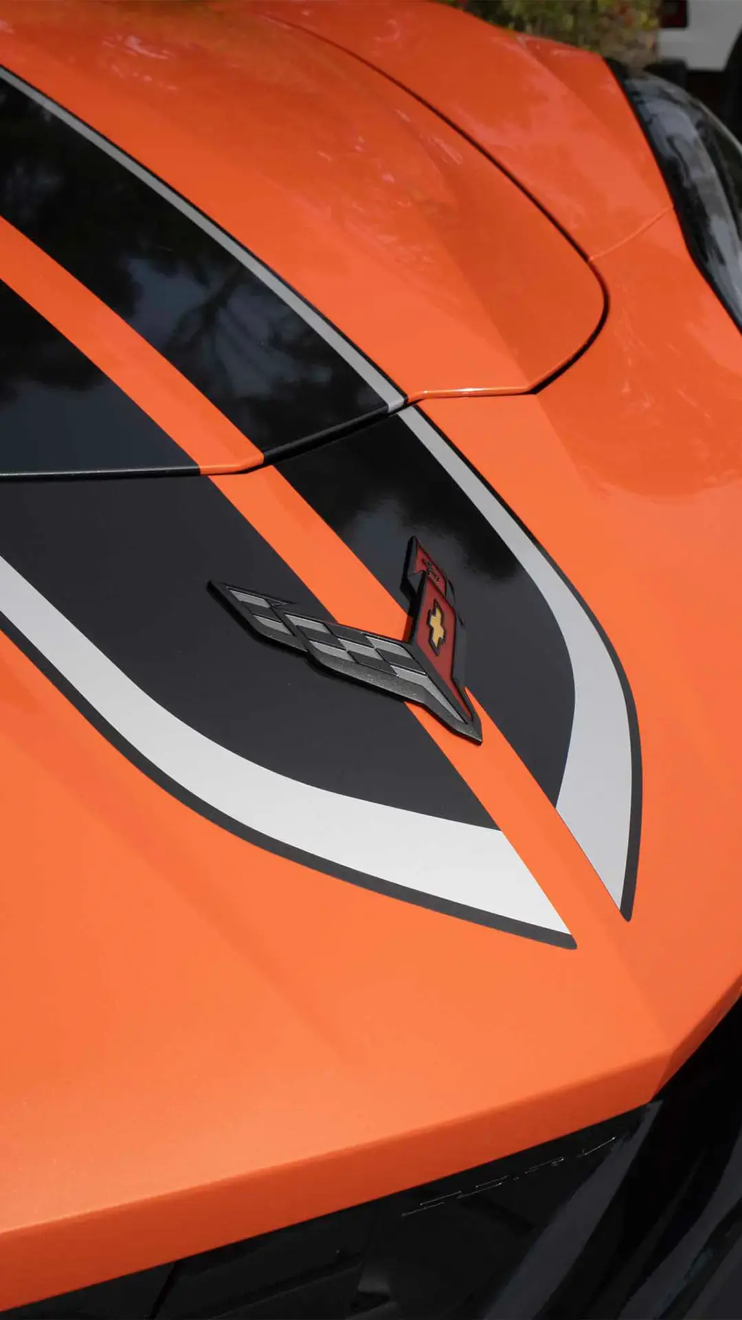 Orange Corvette C8 hood with restored gloss
