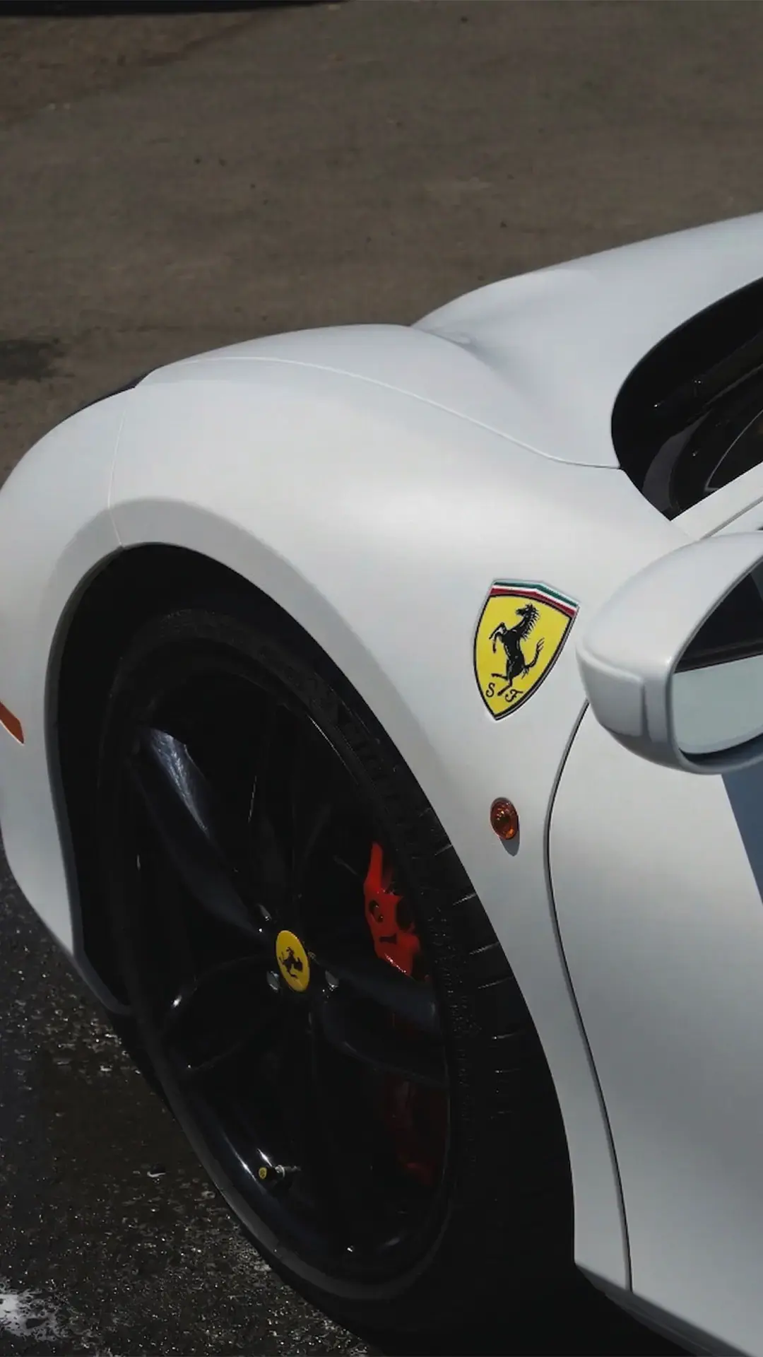White Ferrari 488 with carbon wheels and racing livery