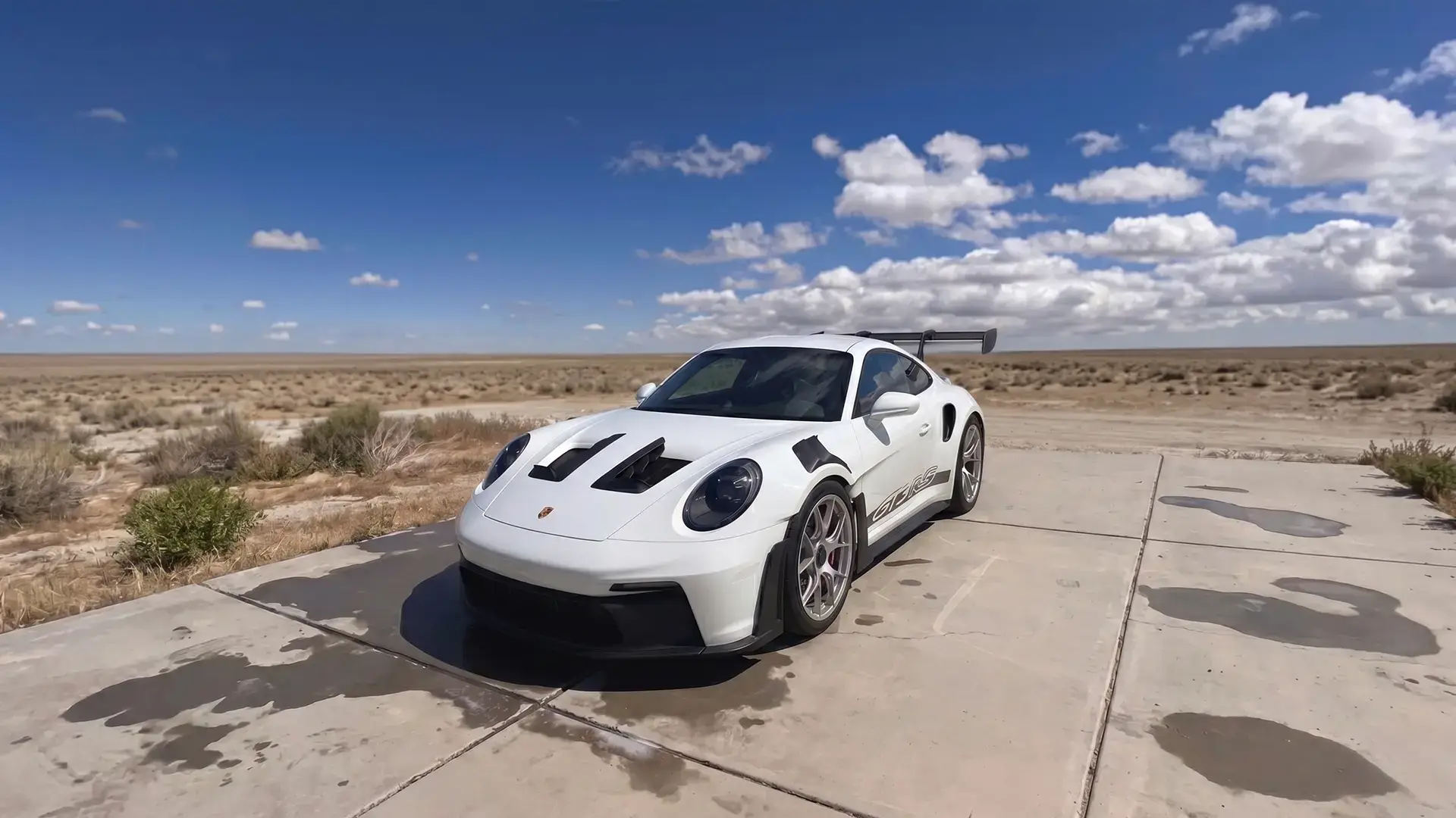 Freshly detailed white sports car under the High Desert sky