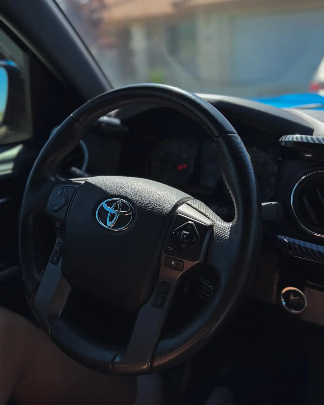 Blue Toyota Tacoma exterior cleared of off-roading contamination